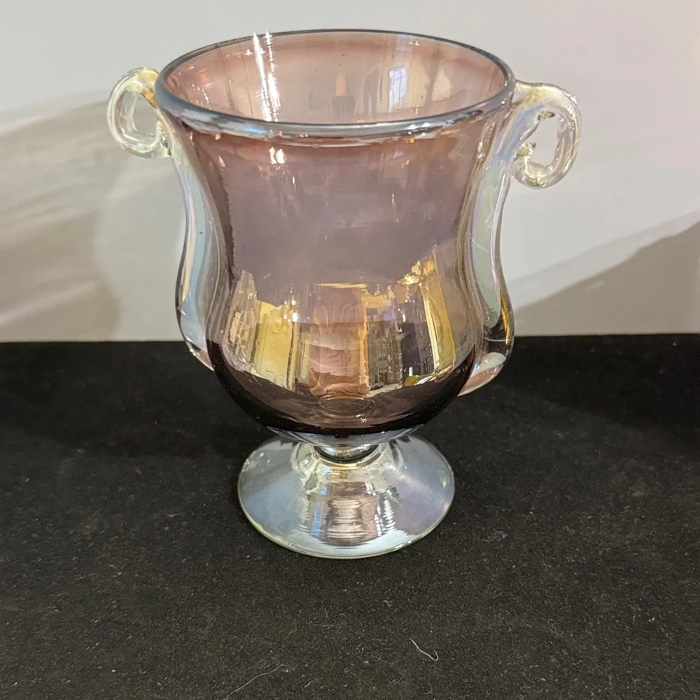 Handmade iridescent glass urn vase with double handles and a pedestal base